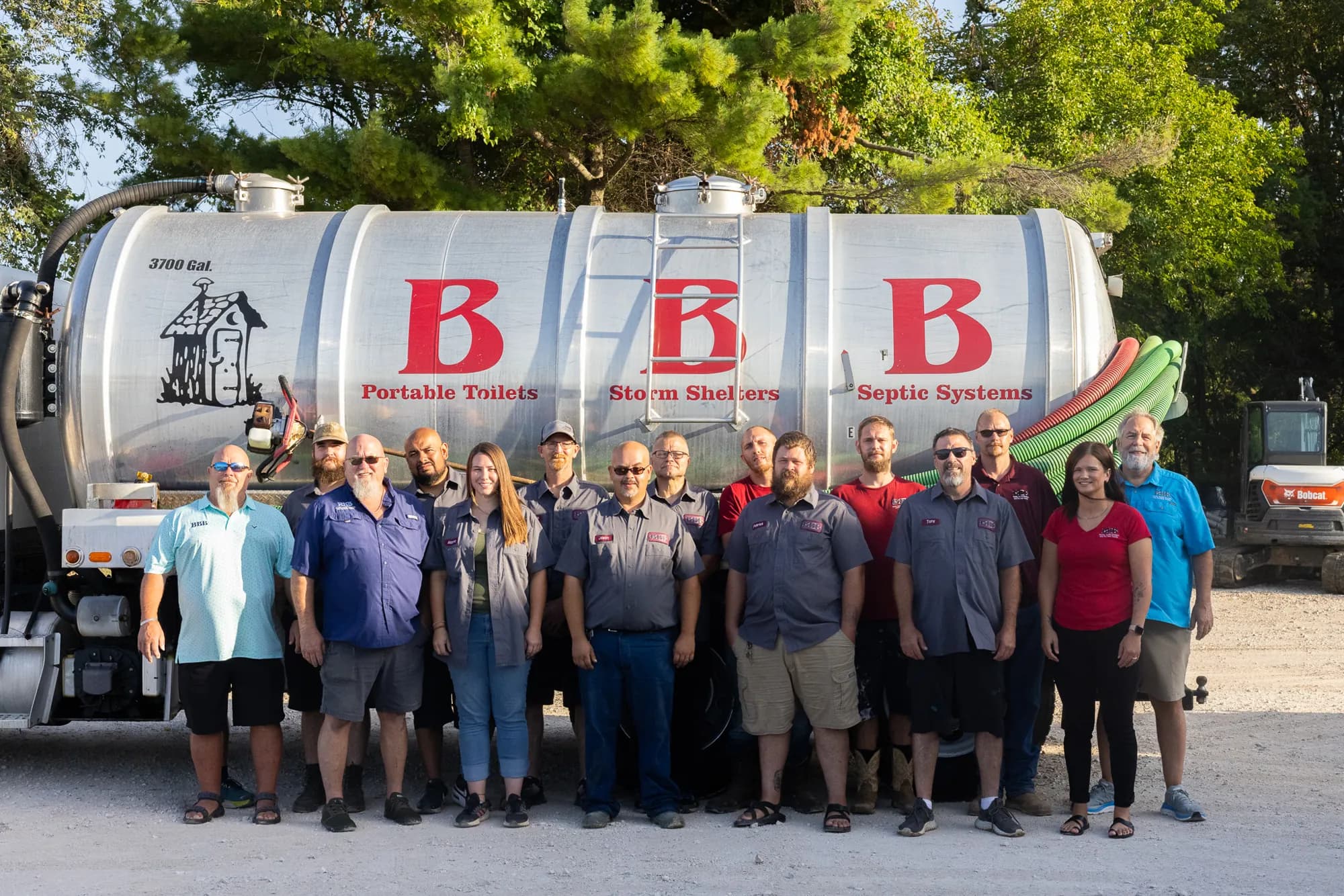 The BBB Septic team in front of a pump truck